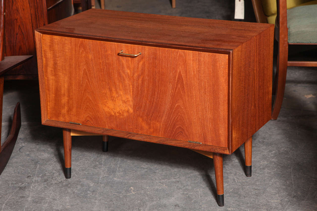 Vintage teak record Player cabinet! This great piece has a drop door and sliding deck to hold a record player, as well as a space to nicely tuck away your favorite vinyls!

Ready for pickup, delivery, or shipping!