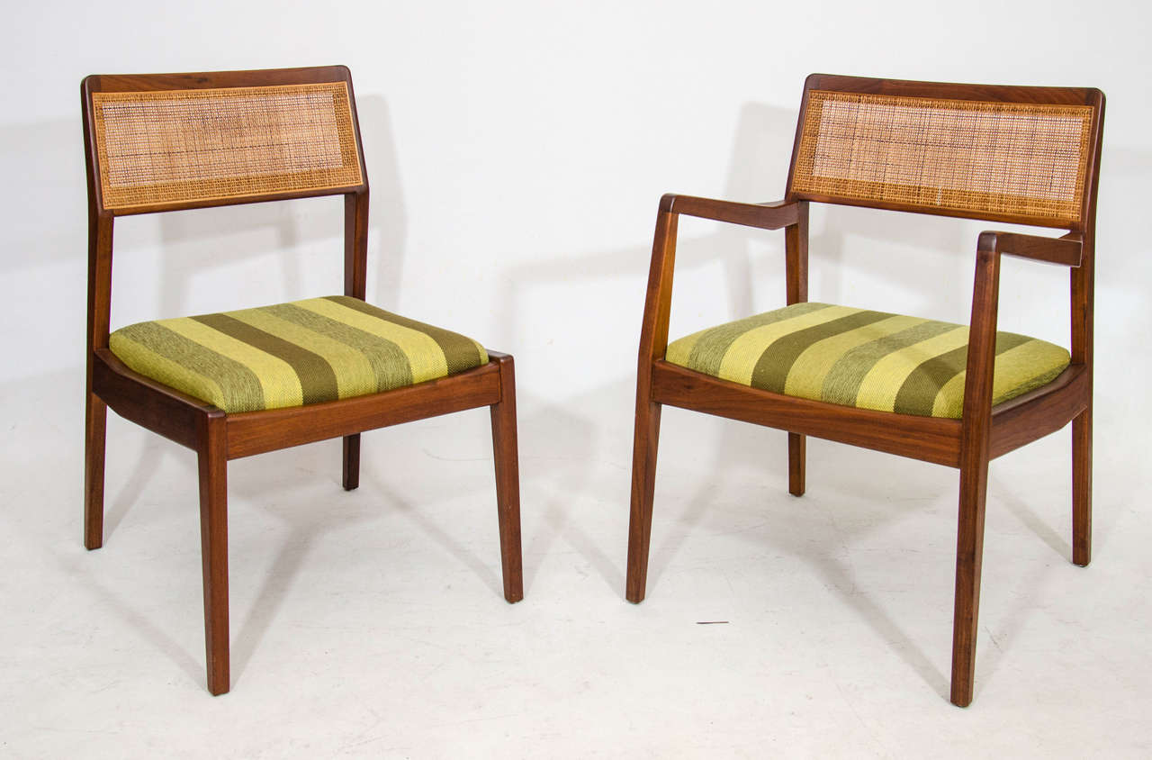 Handsome set of eight dining chairs by Jens Risom: Two armchairs and six side chairs all nicely detailed and accented with caned back rests. Matching Jens Risom dining table also available. Please contact for location. 