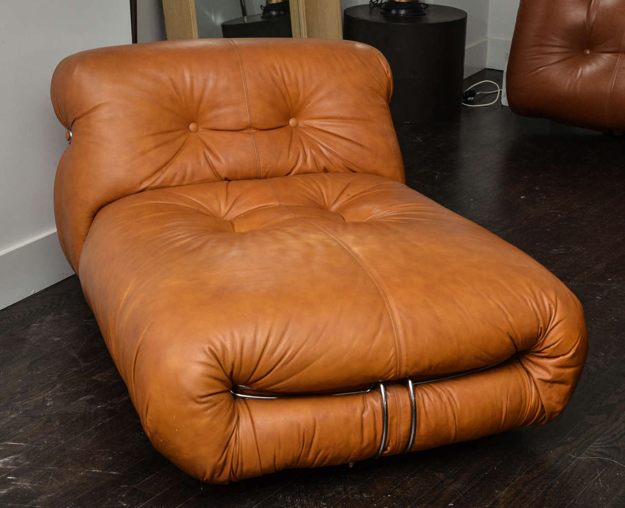 Unique sculptural tufted leather chaise was designed by Tobia Scarpa for Cassina Italia and sold in U.S. by Atelier International.  Leather has beautiful patina and is extremely comfortable.