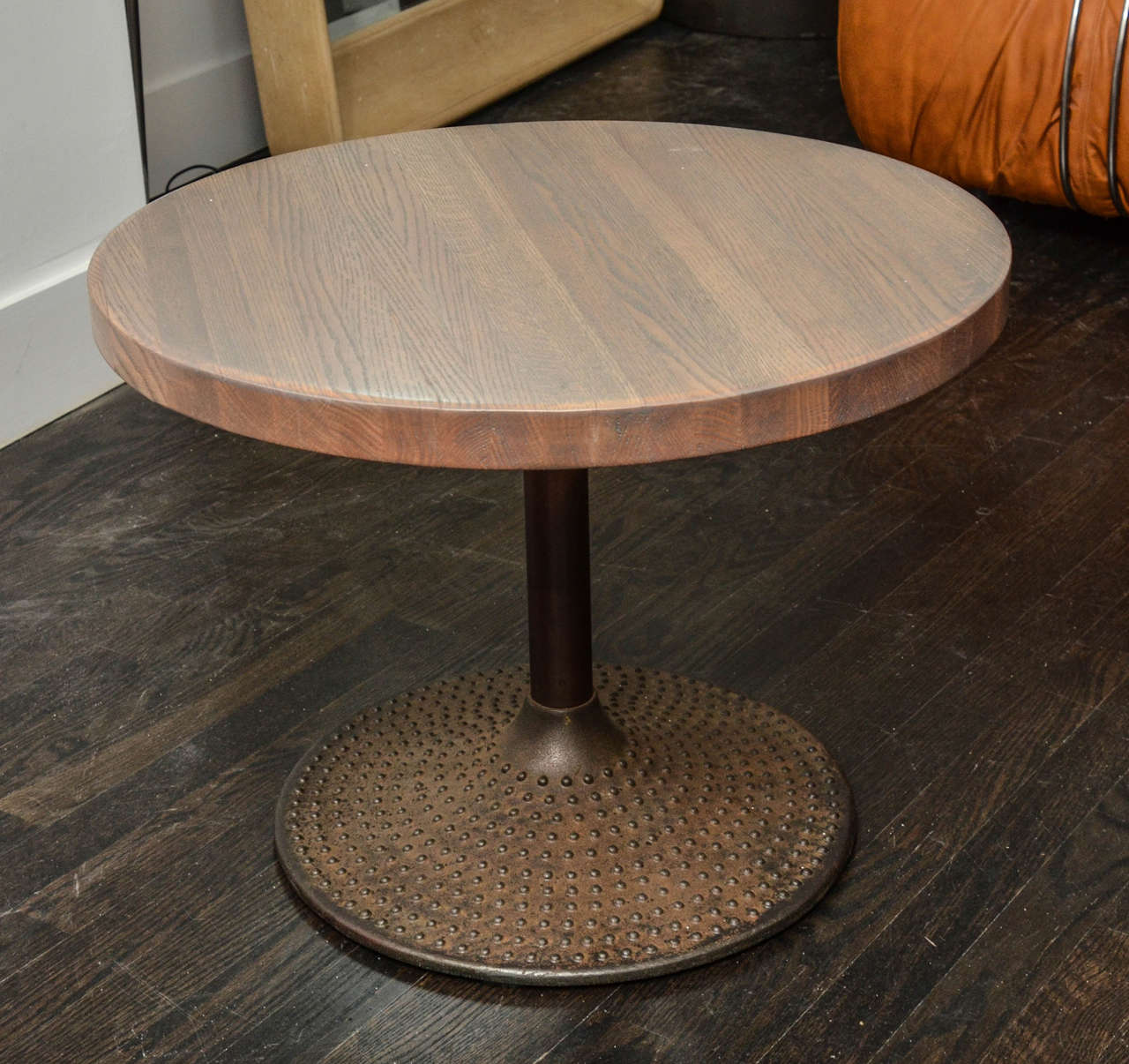 Hobnailed patinated bronze based side tables with round bleached oak tops.