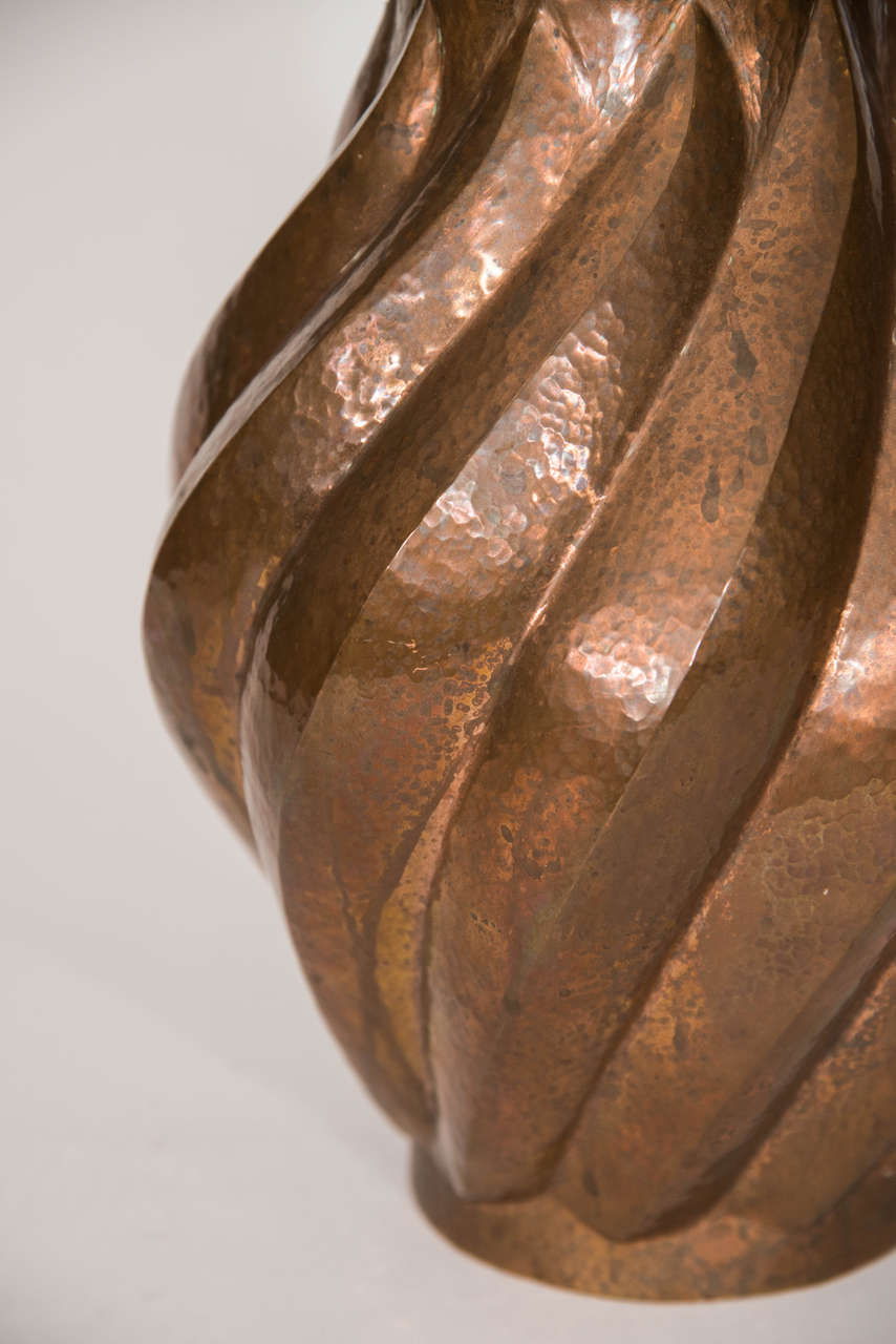 Monumental hammered and patinated copper vase.