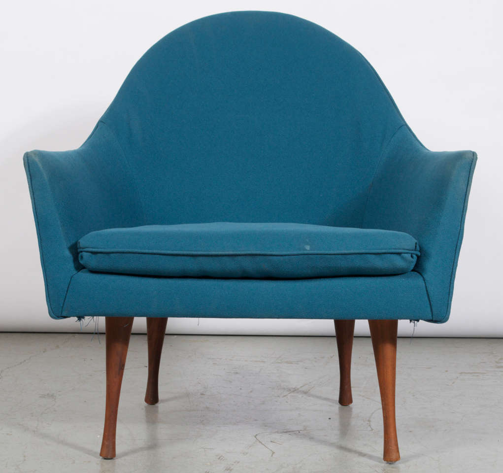 A lounge chair by Paul McCobb. Original teal upholstery. Part of the 