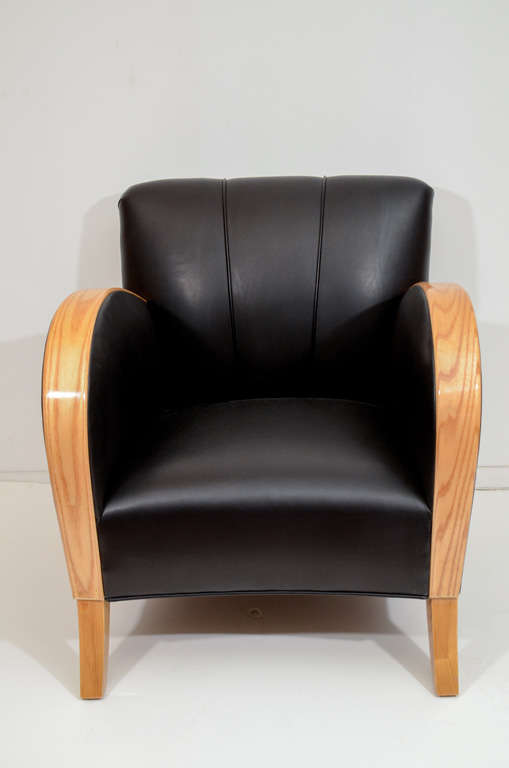 Clad in black motorcycle leather, the durable choice of Harley Davidson, the channel backed club chairs are tailored to provide lumbar support, while the deep seat and low seat height make these versatile chairs suitable for many body types. Deeply