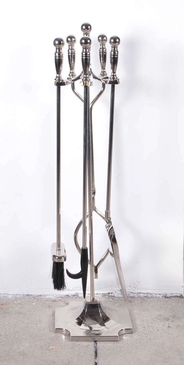 Glam 5 piece set of polished nickel Hollywood Regency fireplace tools. Set includes stand, poker, tongs, shovel, broom.