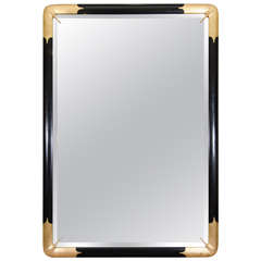 A Mid Century Ebonized Wood and Gilt Wall Mirror by LaBarge