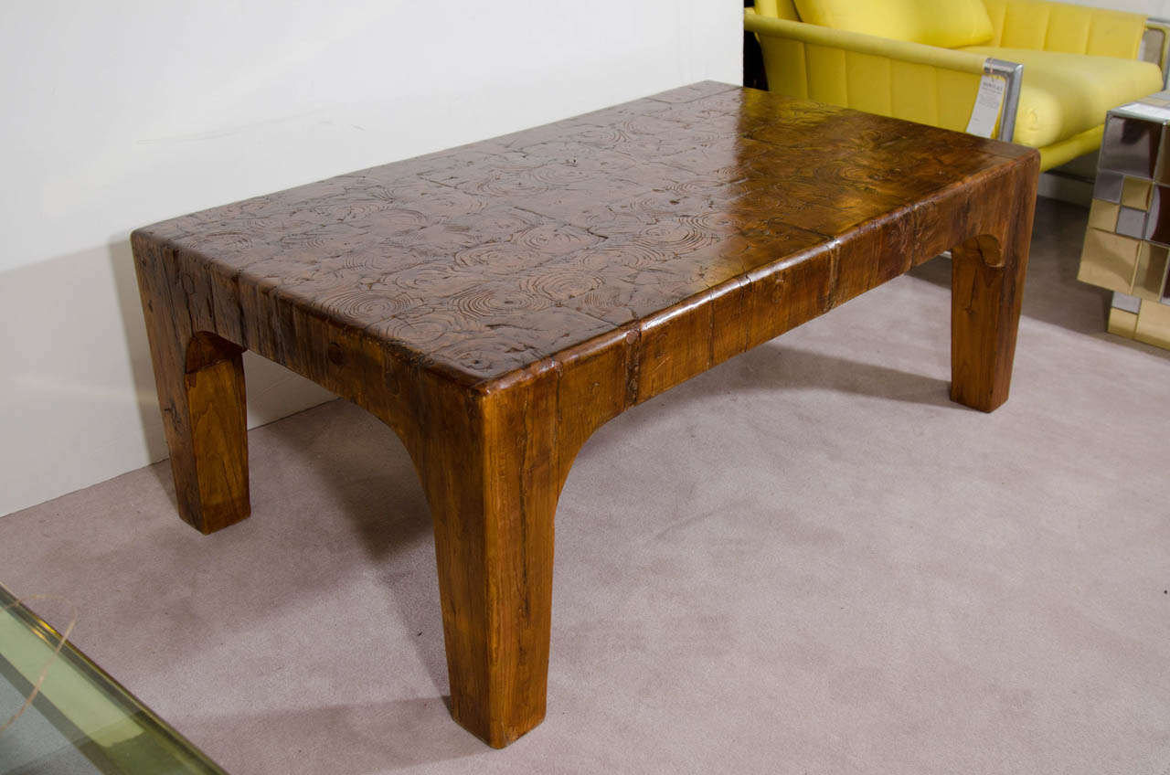 A vintage heavy rectangular shaped coffee or cocktail table comprised of wood blocks

Age appropriate wear with some stress fractures