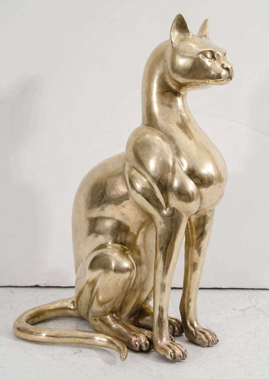 A vintage, Egyptian-inspired doré bronze sculpture of a cat. In good condition with age appropriate wear. Some marks.