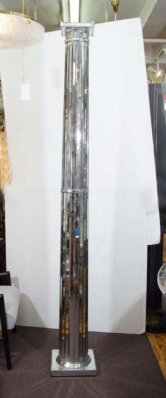 A single doric style column with mirror mosaic. Good condition with some presence of age and silvering to the mirrored pieces.
