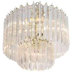 A Mid Century Two-Tiered Lucite and Brass Chandelier