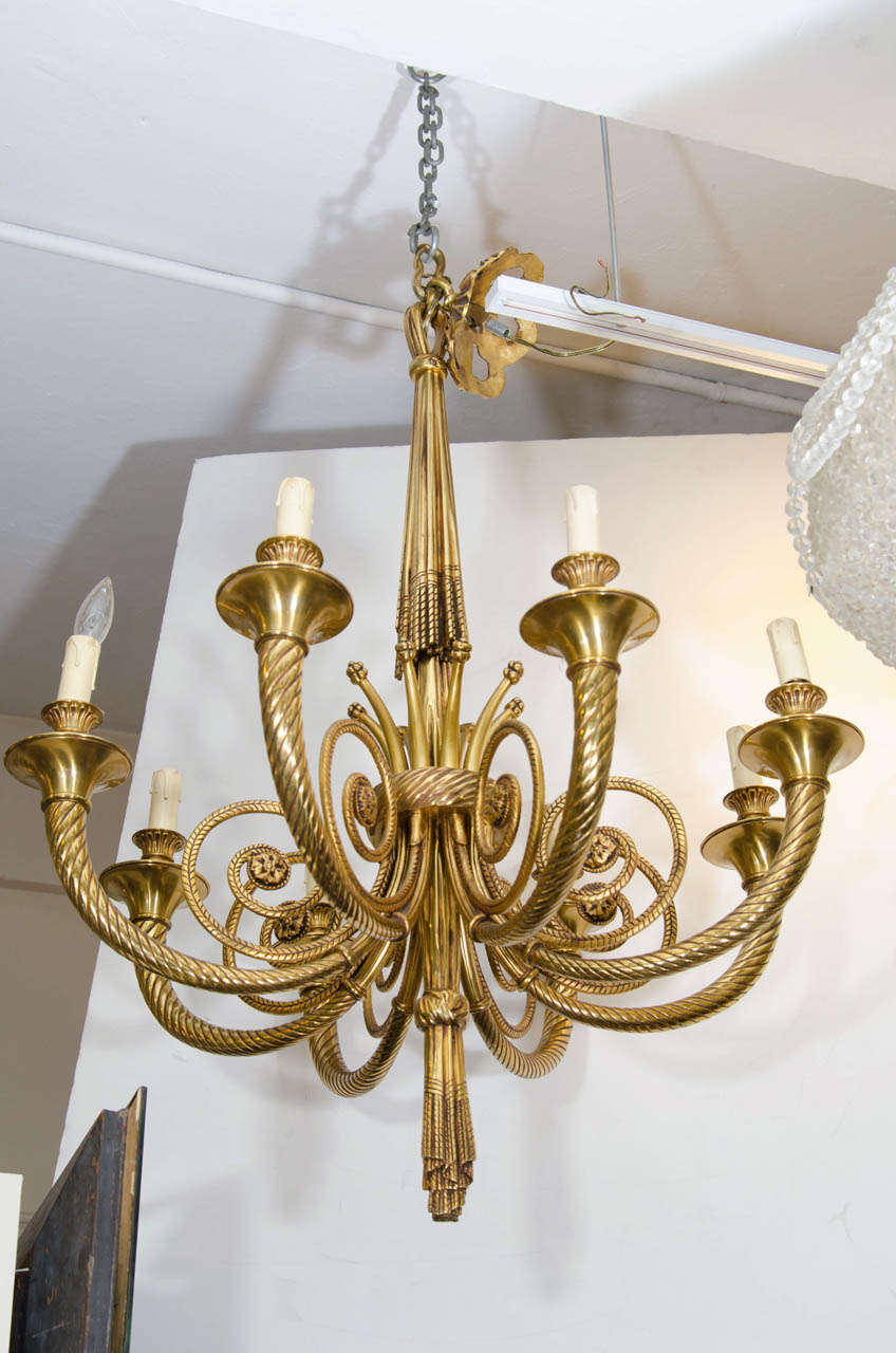 Neoclassical style twist arm ornate bronze chandelier with eight lights. Good condition with age appropriate wear