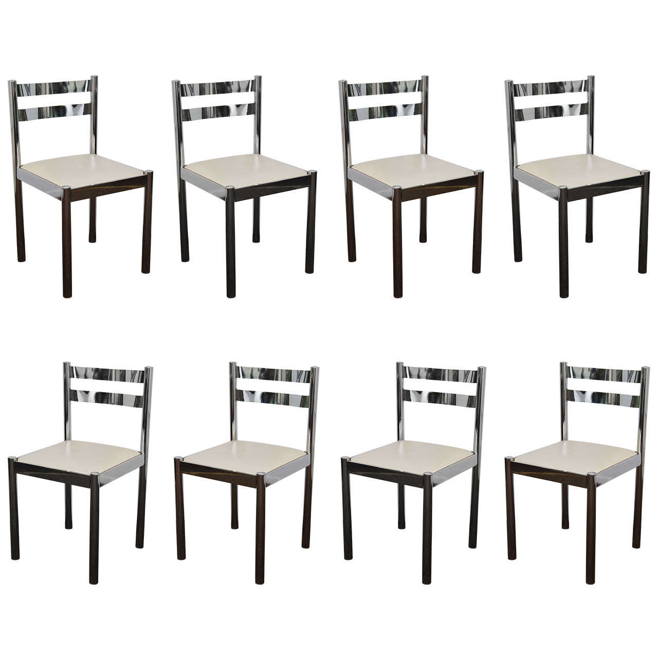 A vintage set of eight chrome chairs upholstered in white vinyl with a chrome and glass kitchen or dining room table.

The chairs are in vintage condition with age appropriate wear. Six of the chairs have some scratches, pitting and/or chipping;