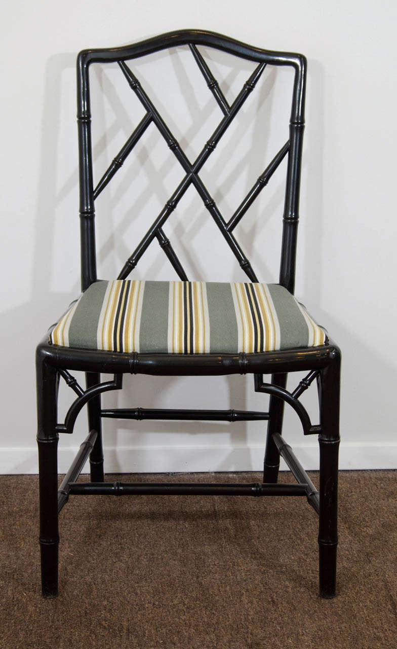 A vintage set of six Faux Bamboo Chinese Chippendale dining chairs in black lacquer with striped upholstery.

Reduced from: $6,500