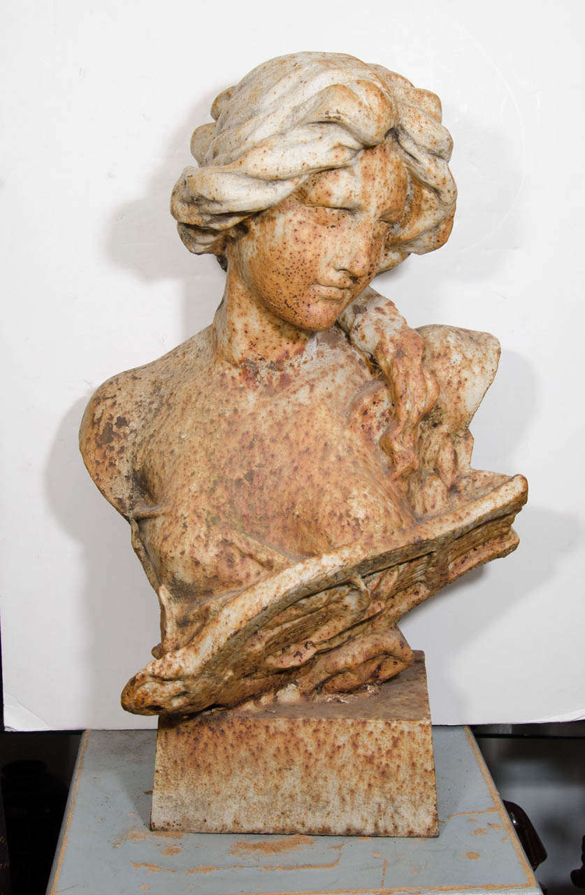 An Art Nouveau garden sculpture of a woman made from cast iron. Good condition, with age appropriate patina