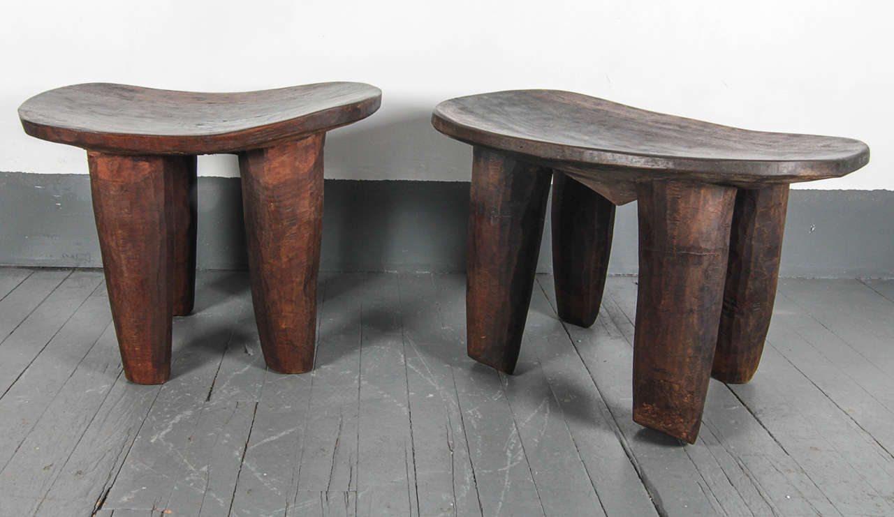 Hand carved stools made from one solid piece of wood.