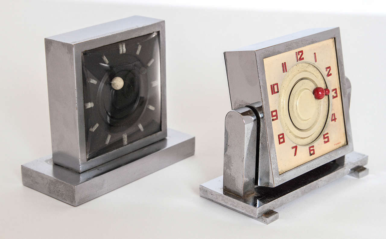 French Art Deco clock moon and sun manual wind eight-day, six jewels black only
White clock sold

Machine Age modernist design desk or vanity clock. 
Signed: 8 days, 6 Rubis. Brevete´ S.G.D.G., France et Etragnger, Depose, Metal, Unadj., six