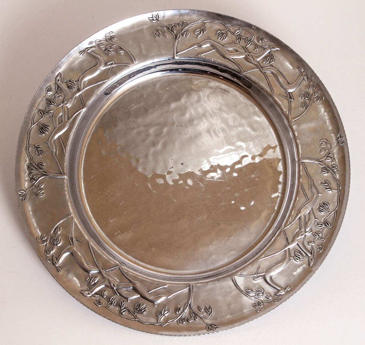 Very nice example of 1930s-1940s hand-forged American aluminum ware.
Stylized gazelles and trees.
Very nice workmanship.
Original glass condiment insert.
Signed.