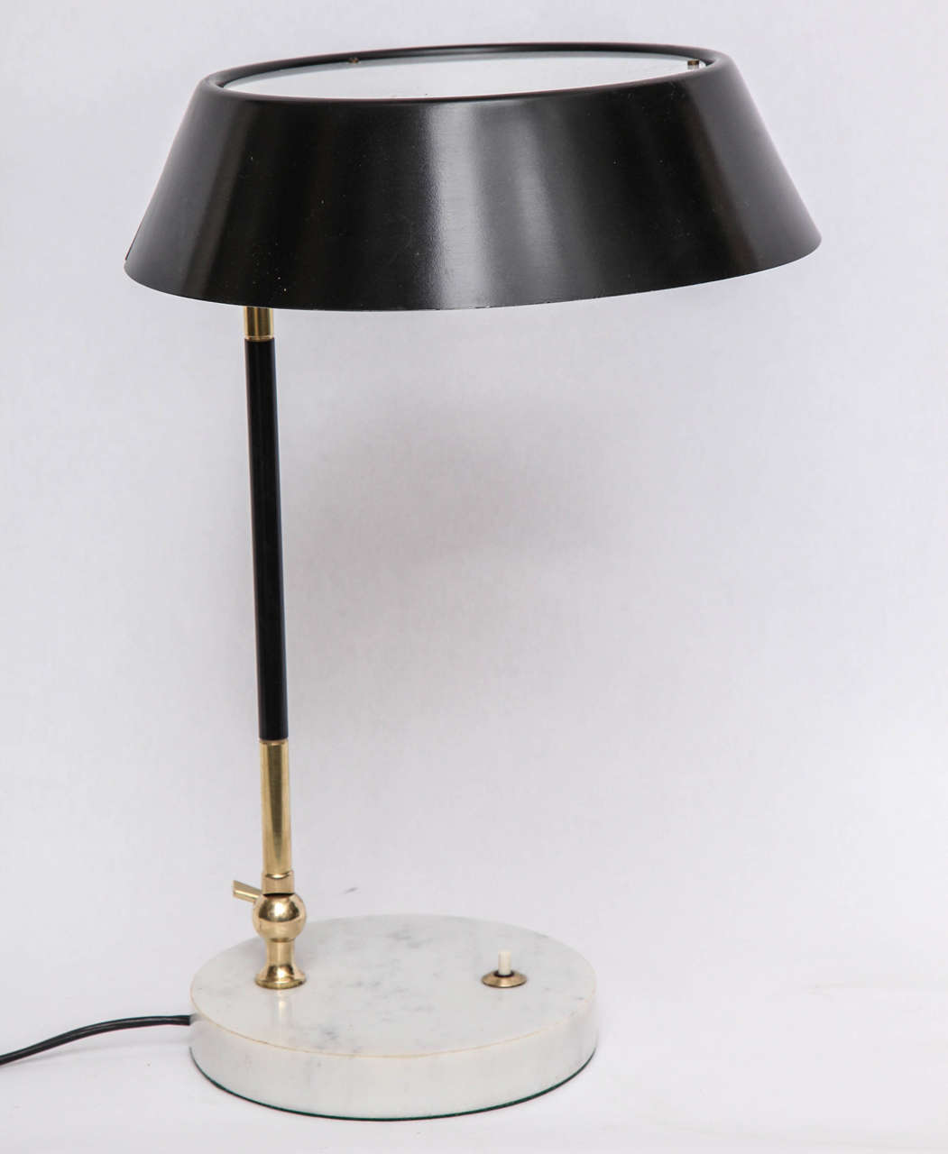 A 1950s articulated table lamp signed Stilux.