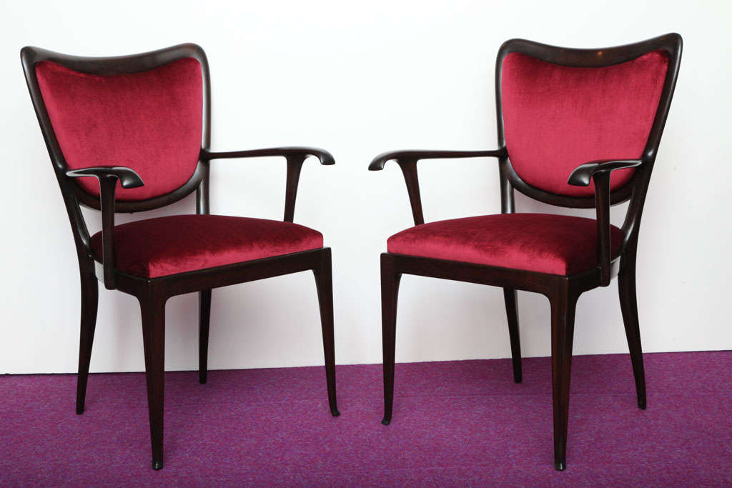 Elegant forms of solid mahogany with graceful arm details.  Upholstered in burgundy colored velvet.  These chairs are pictured in the Paolo Buffa book.  *To see our entire inventory, go to www.donzella.com