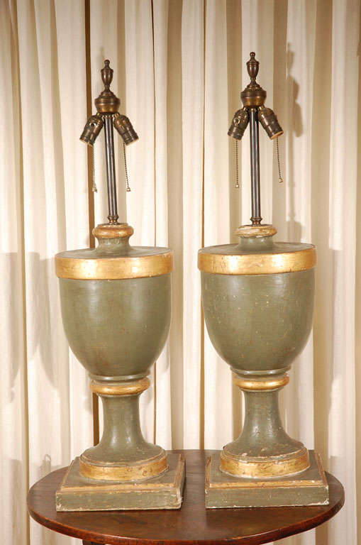 Lamps newly made from original 19th century Italian finials.
Original muted green paint over gesso and gilt trim. As these pieces were hand made they are not identical, but so close in appearance as to make a great looking pair. Large and