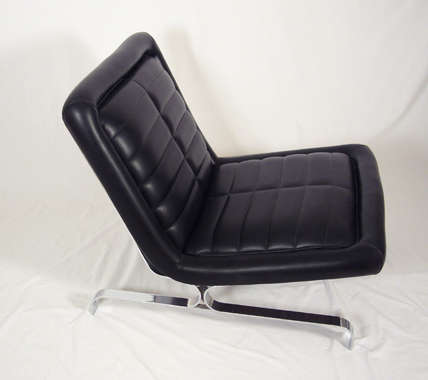 Pair of chrome frame lounge chairs with black leather seats and channel stitch detailing.