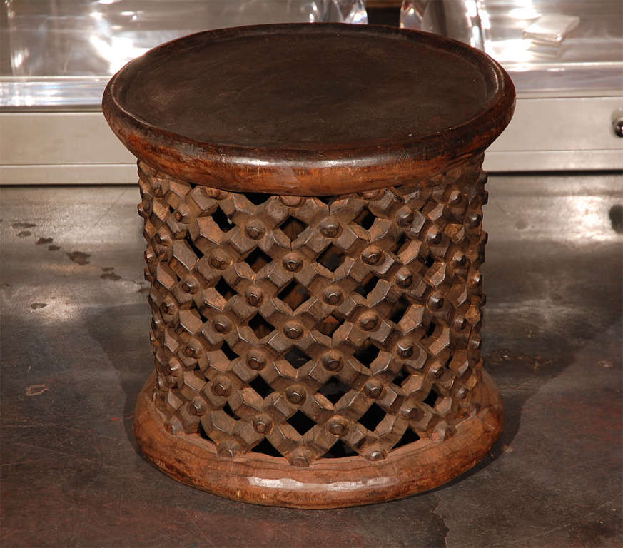An African drum table from the Banileke tribe in Cameroon. Beautiful handcarved detail.