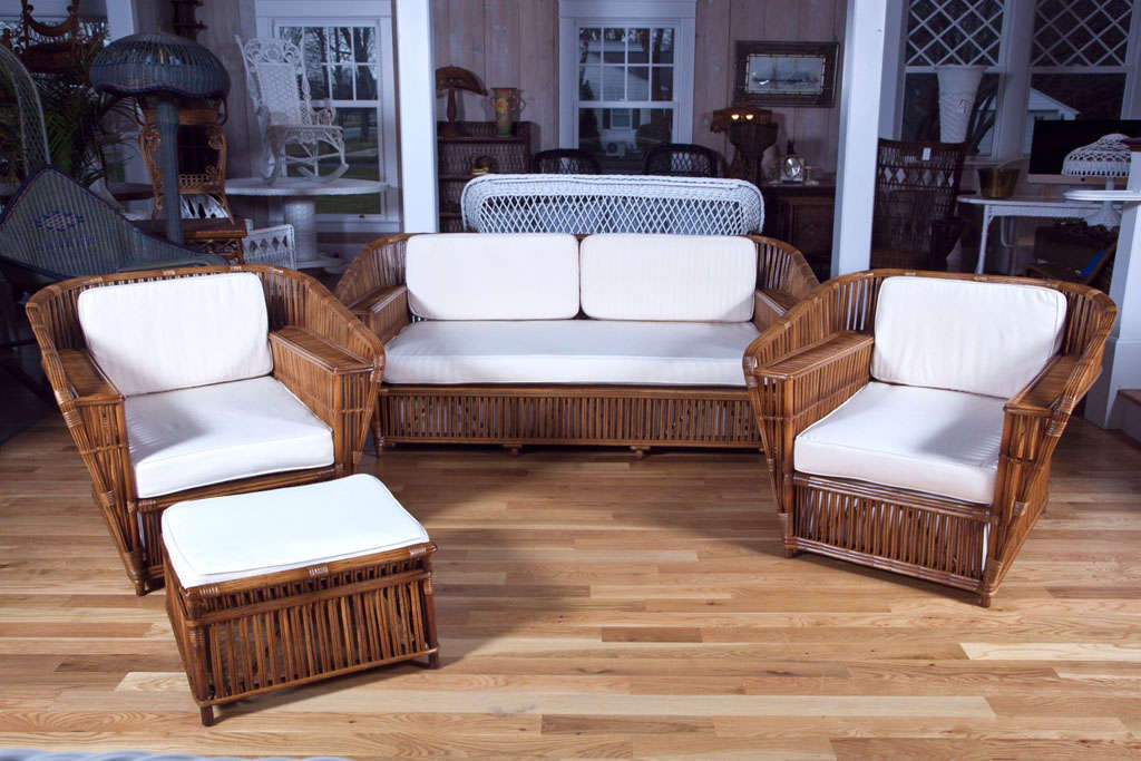 Outstanding and rare rattan sofa, chairs and ottoman in natural finish.  New cushions sit on upholstered box springs for exceptional comfort.  Large scale and extremely sturdy.

Dimensions:  sofa -  76
