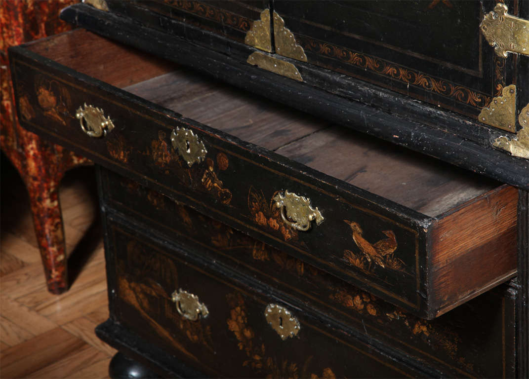 A George I Parcel-Gilt Decorated Black Japanned Cabinet on Chest 1
