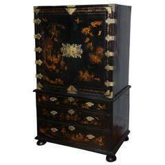 A George I Parcel-Gilt Decorated Black Japanned Cabinet on Chest