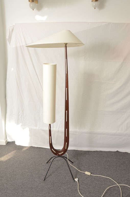 Bio-morphic shaped walnut floor lamp designed in the 50's by Rispal. This lamp is an outstanding example of the influence French art had on the French design world. Documented in 1000 lamps.