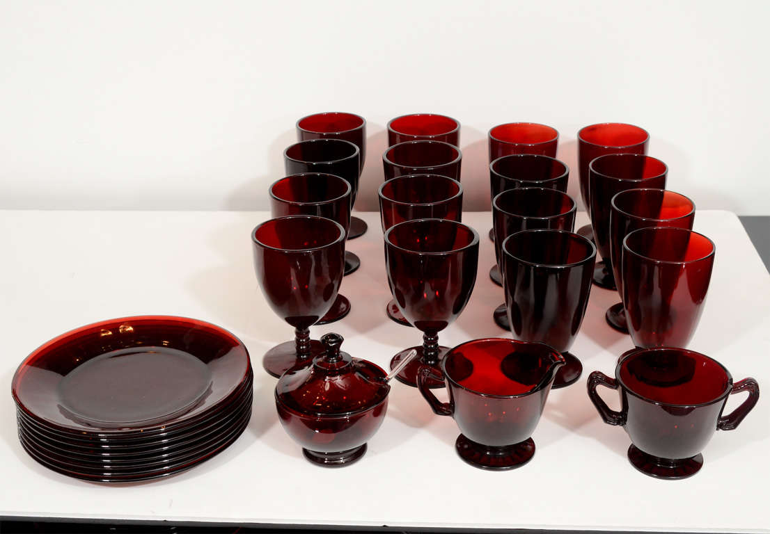 This Art Deco glasssware set is the most rare and collectable of all the depresssion era glassware colors. This set features Eight water goblets,Eight wine glasses sugar bowl,creamer and eight multi purpose plates.