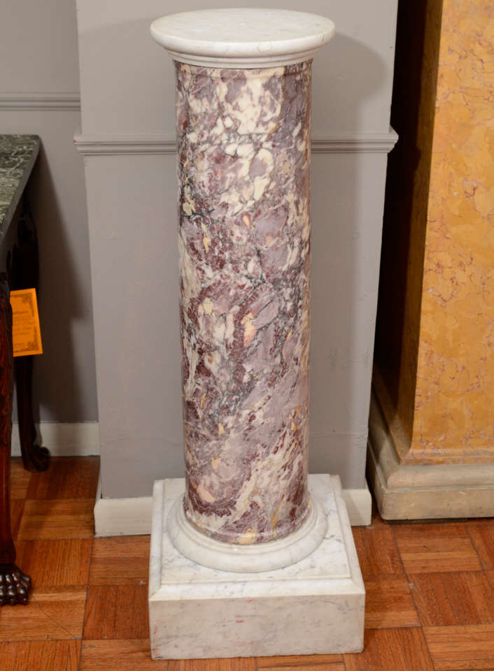 18th century Breccia marble column pedestal. With a white marble capital above an entastic column, resting on a square pedestal with a cavetto edge.