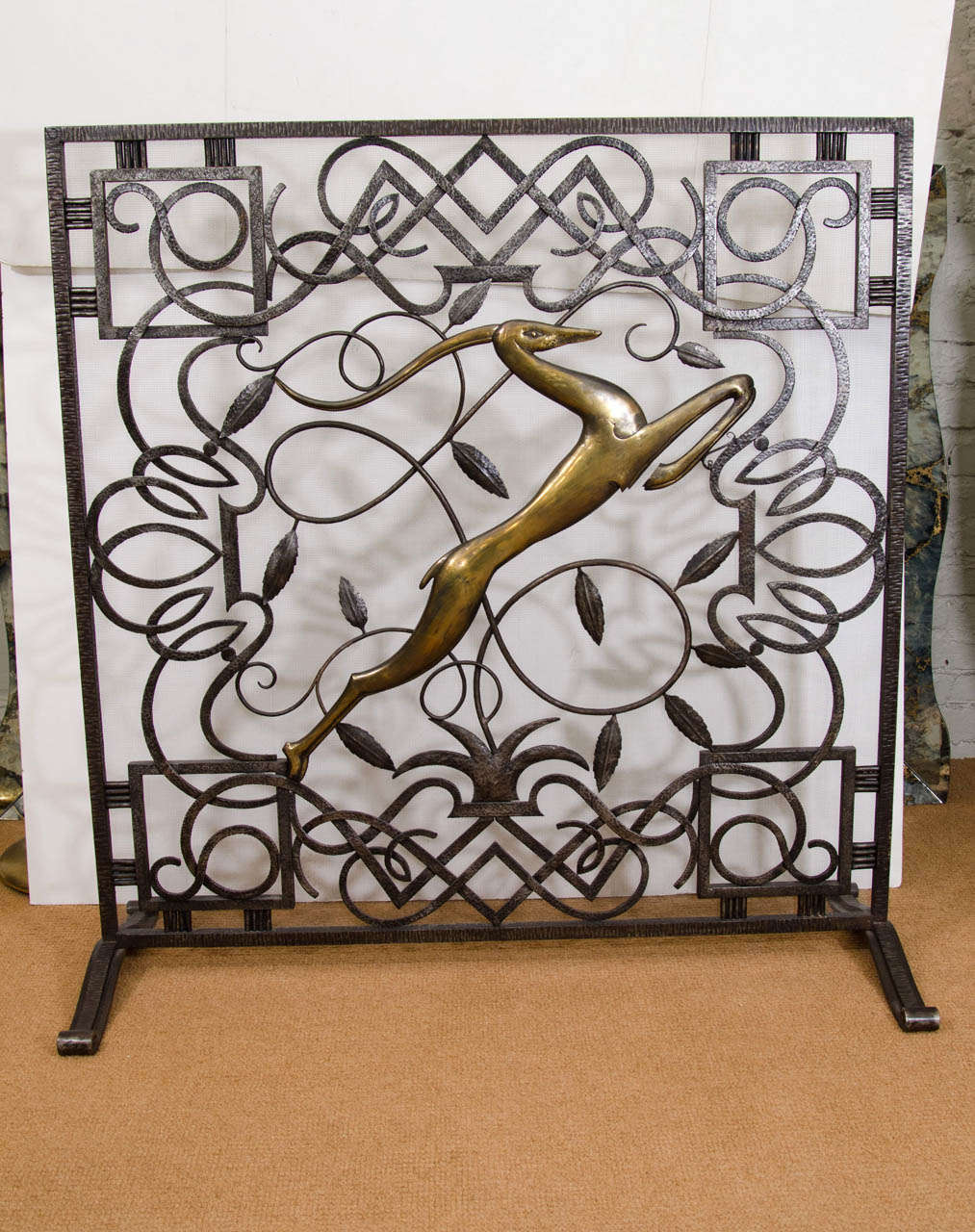 Elegant screen from deco era. Wonderful carved brass gazelle make this a one of a kind piece.

Dimensions listed are at maximal points of the screen - actual body of the main body of the screen are 38.5