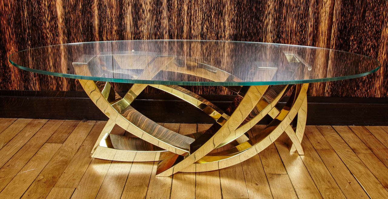 Coffee table like a sculpture
numeroted 1/8 and signed «C. Mercier» on the base 
polished Brass 
Locksmith Metalwork Decorative (SMD)
With certificate of authenticity by the artist