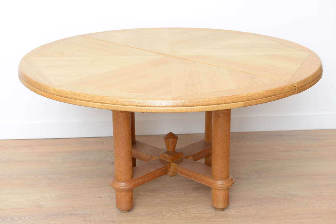 Oak expanding dining table by Guillerme and Chambron for Votre Maison.
Opens in one pedestal configuration to accept two original leaves.
Dimensions: 83