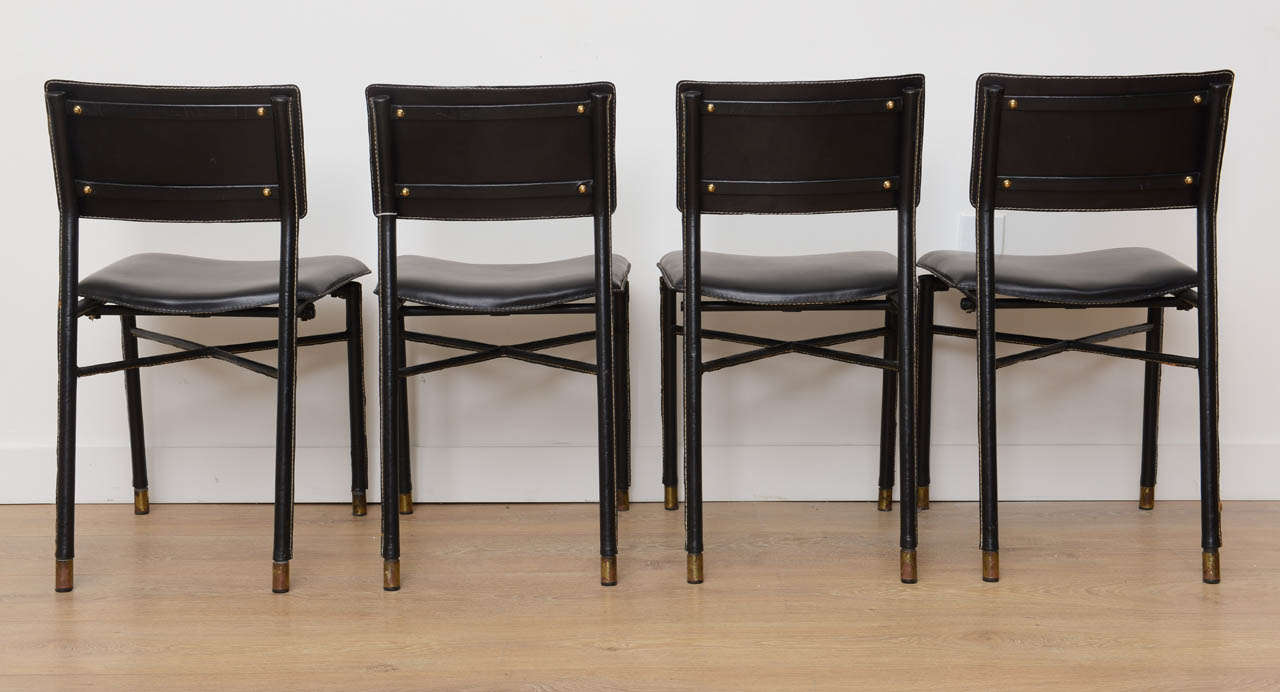 Mid-20th Century Four Hand Stitched Black Leather Chairs by Jacques Adnet