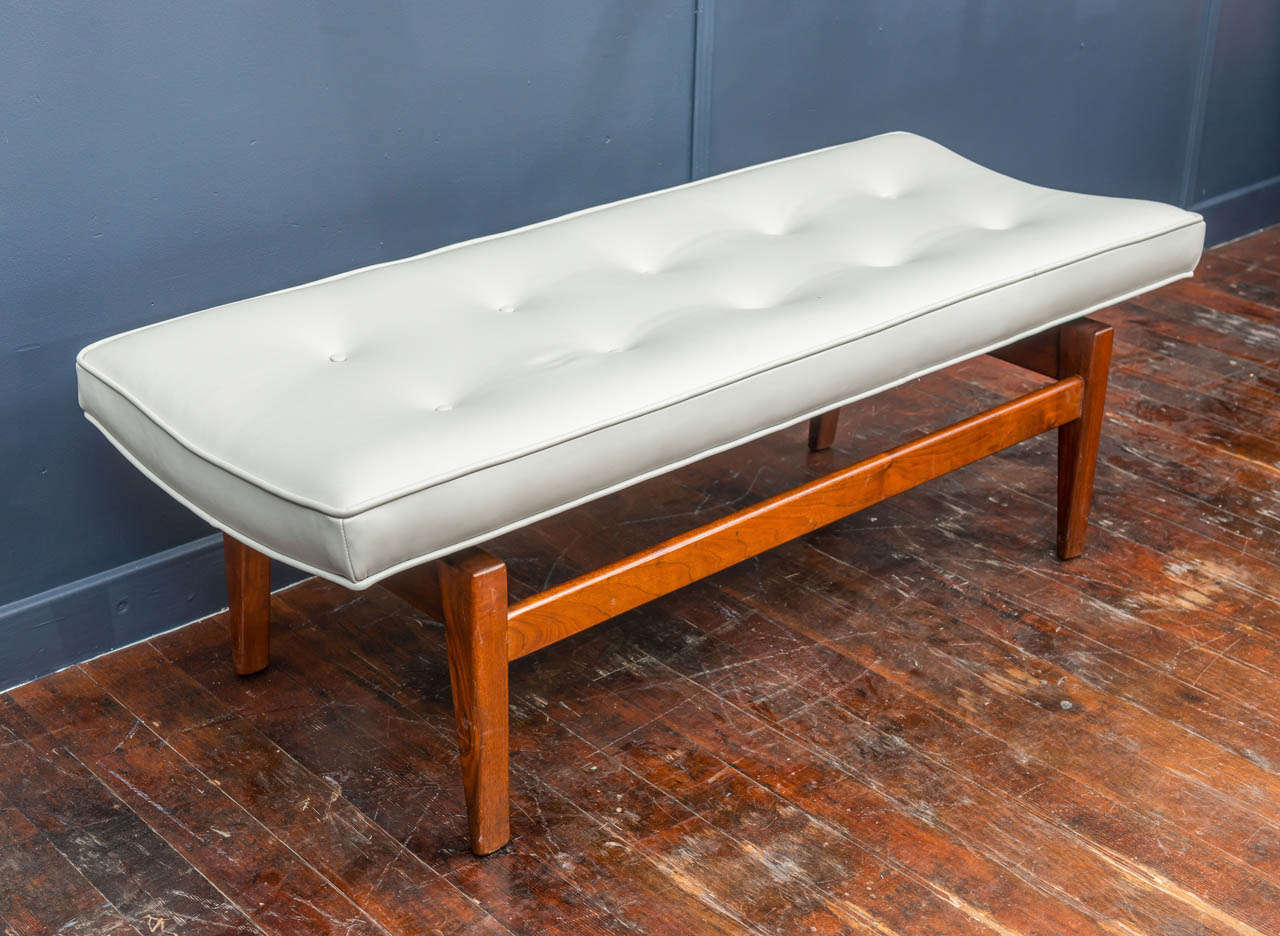 Jens Risom design black walnut bench newly uphostered in dove gray Italian leather.