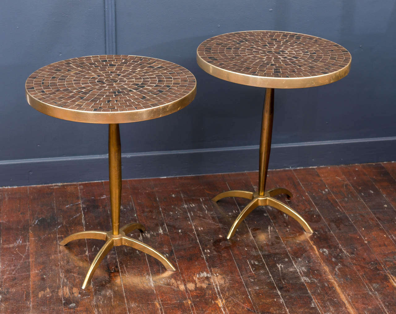 Chic matching pair of Italian tile top and brass side tables. Tops have matching starburst pattern inlay and are an original pair.