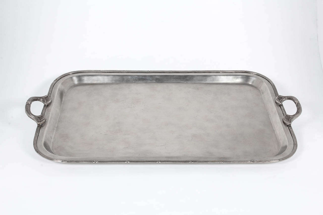 Plated silver tray with handles 
Carving on the handles and along perimeter