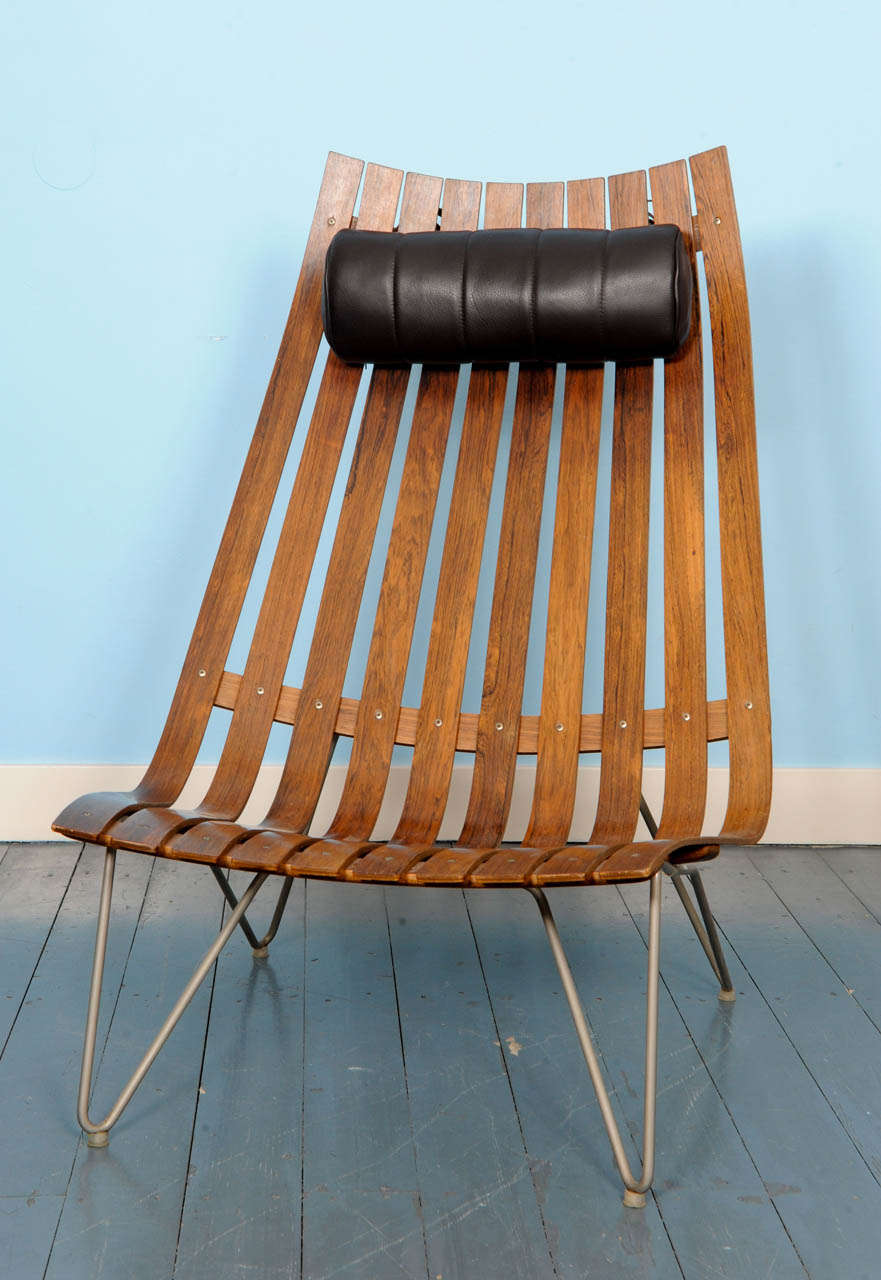 Rare laminated rosewood high back lounge chair by Scandinavian designer Hans Brattrud. This chair comes with the original black neck cushion.