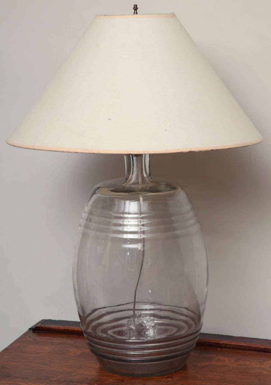 Handblown late 19th century glass spirit barrel, now wired as a lamp.