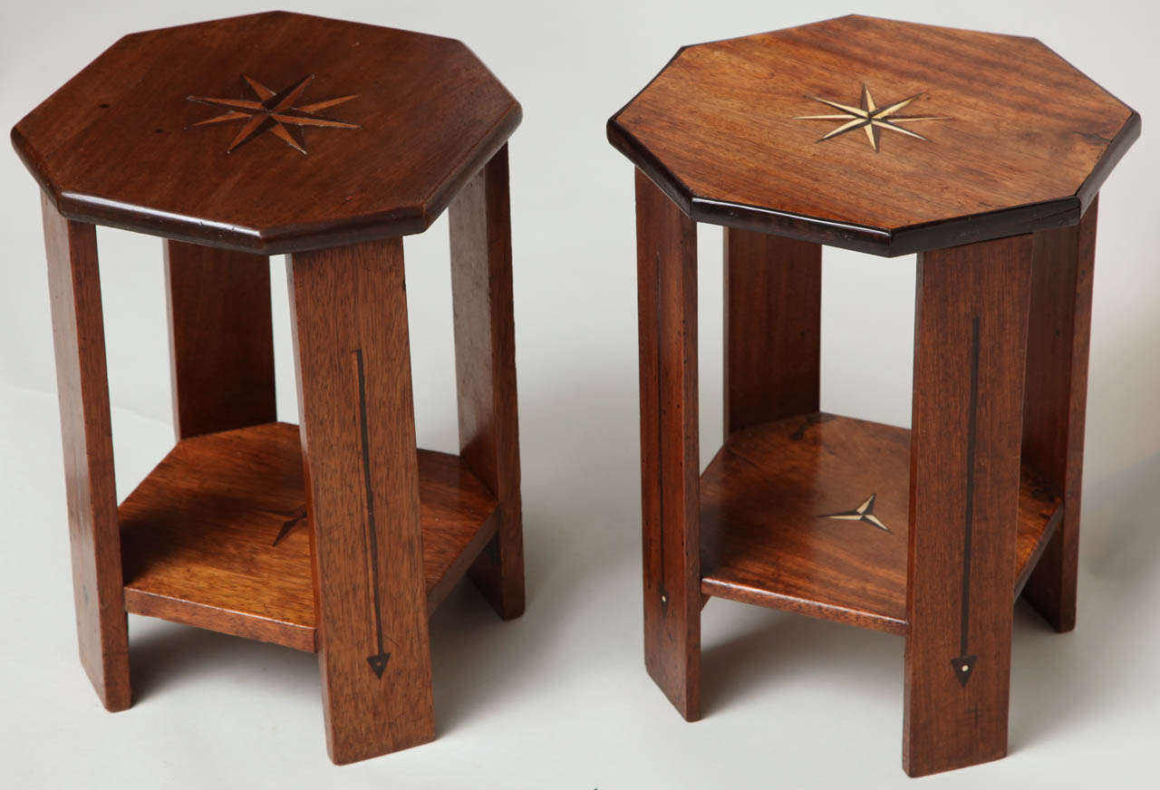 Two similar 1920's Indian teak wood octagonal tables having bone and ebony inlay and very sculptural form.  
