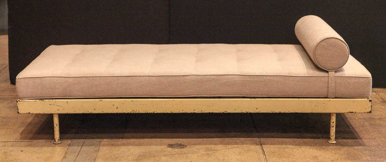 Jean Prouve's scal daybed in yellow crème with newly upholstered cushion and bolster.