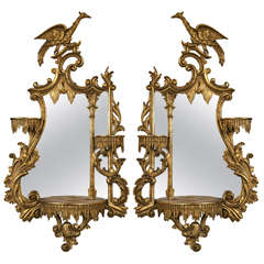 Pair of Giltwood Opposing Eagle Carved Mirrors with Shelves