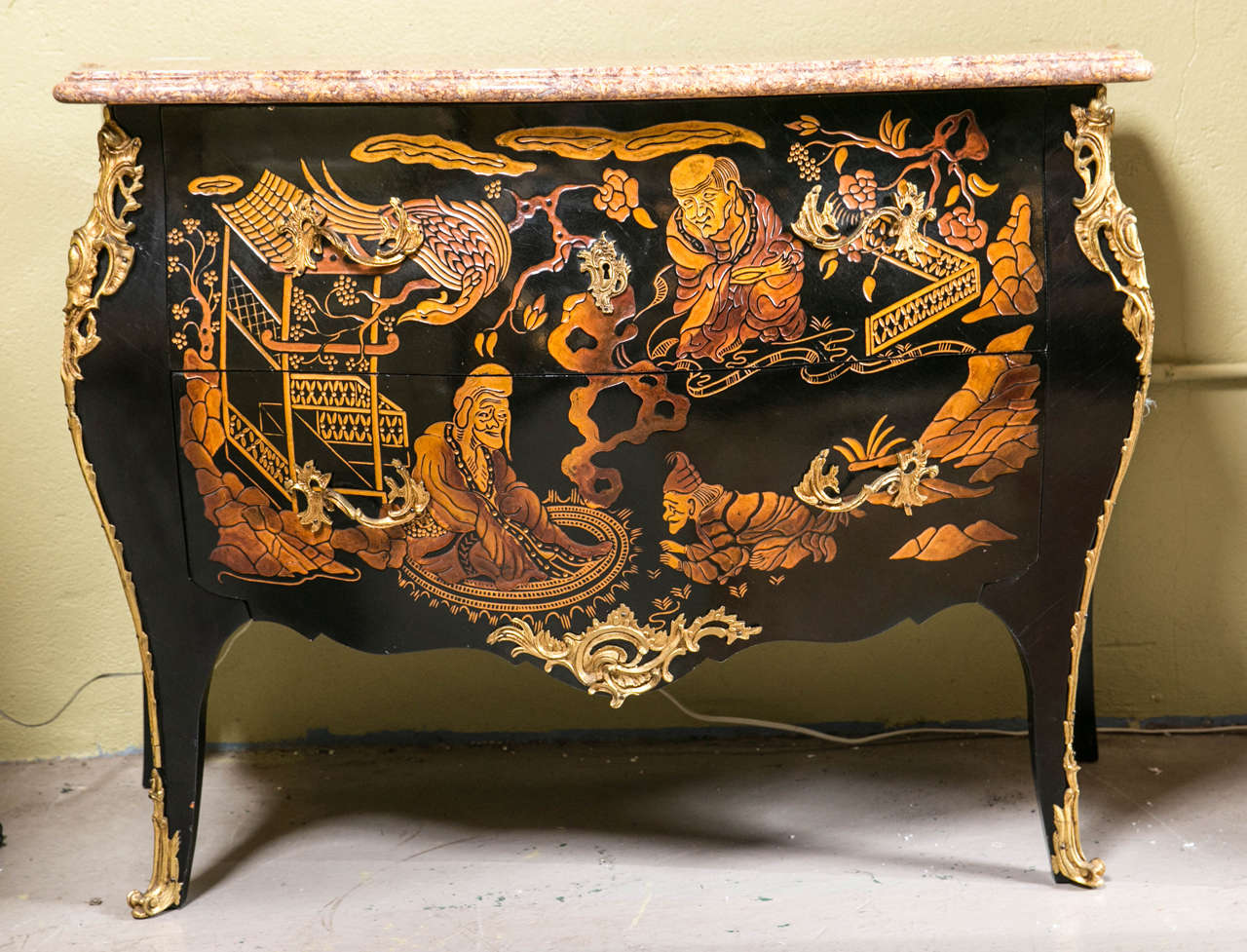 The pair of fine marble-top chinoiserie bronze-mounted commodes possibly by Jansen. Simply the finest pair of marble top commodes you will find. The bronze cast Louis XV style feet having a flowing bronze ornamental mount leading to the cabriole