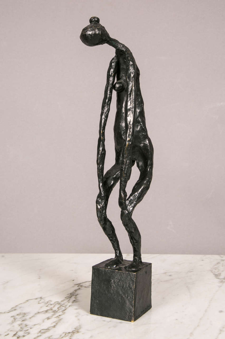 Black patinated bronze standing woman by Robert Couturier (1905-2008).
Woman bending her head and her arms down to the knees. 
Signed, numbered 2/6, Susse stamp on cubic base.