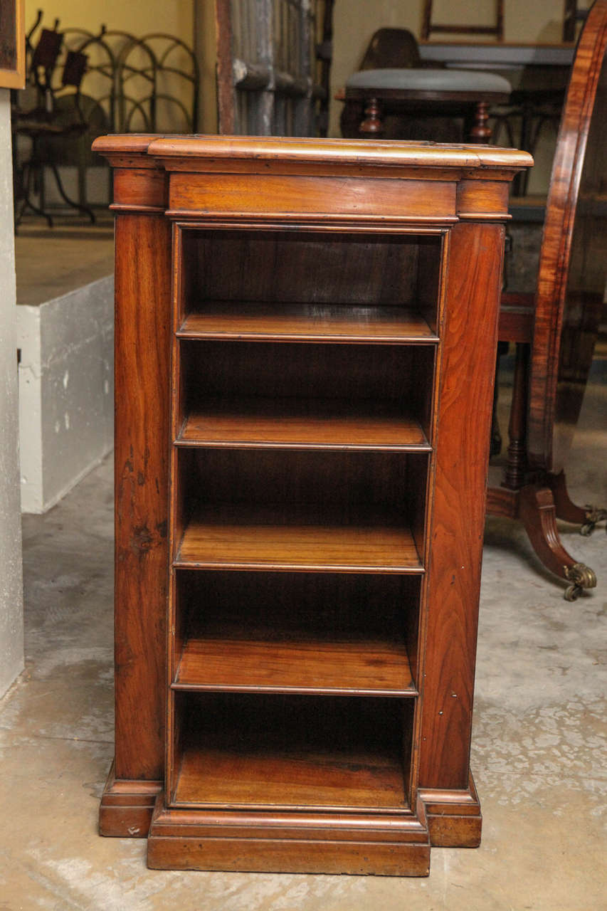 A detailed four-sided wood display case from France, circa 1850. Can be used as a four-sided bookshelf or cabinet with open shelving. The top is flat allowing for use as an occasional table, plinth or pedestal.