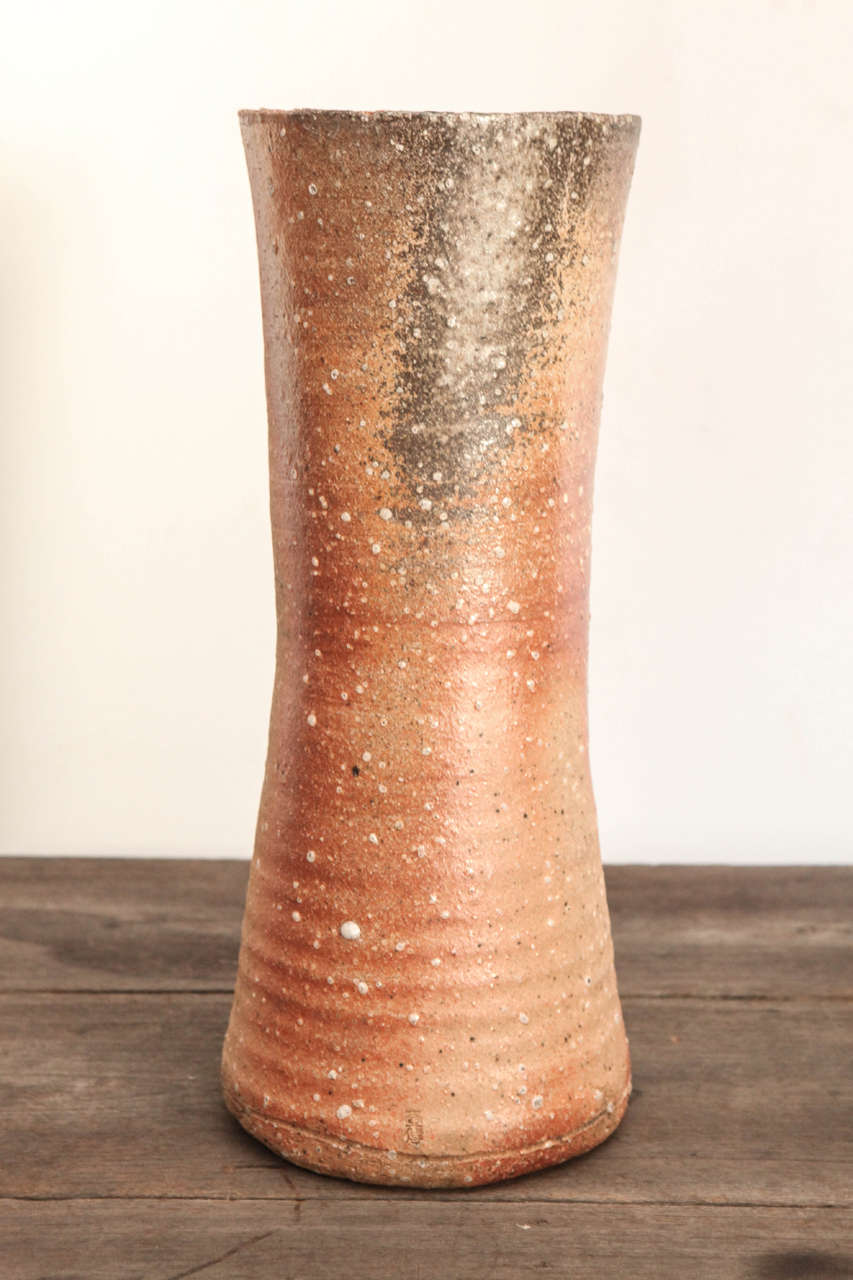 Large Japanese ceramic vase in red speckled glossy glaze.