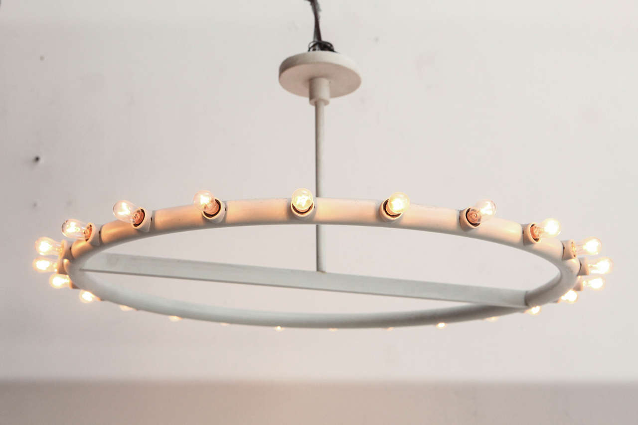 Rare twenty-four bulb ring chandelier in the style of Alvin Lustig. 12