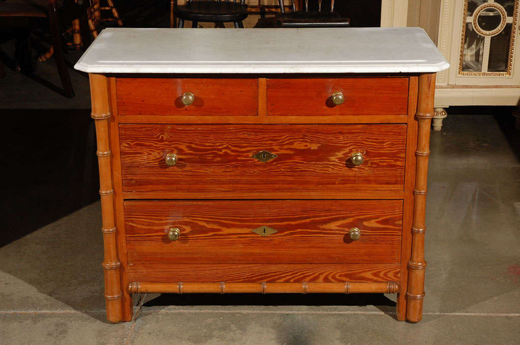 A very nice chest of two over two drawers, probably French, circa 1880-90, with decorative elements in the faux bamboo manner. This piece would work well in any number of settings. Jefferson West Antiques offer a selection of antique pieces of