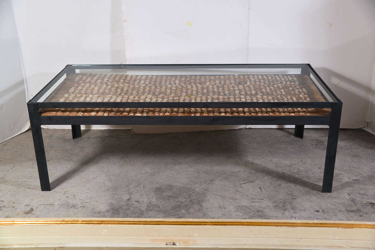 Spanish 19th century wheat thrashing board from Spain used to cut the wheat in farming, set into newly made iron table with glass top.